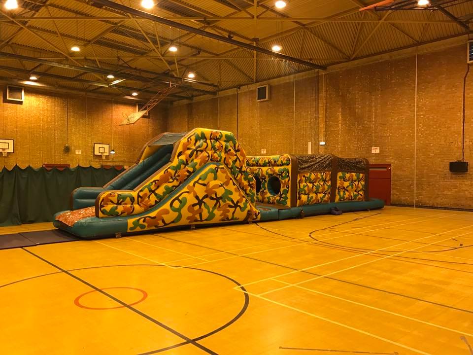 This image shows the bootcamp inflatable obstacle course on hire in a sports hall in St Helens Indoor obstacle course hire in St Helens