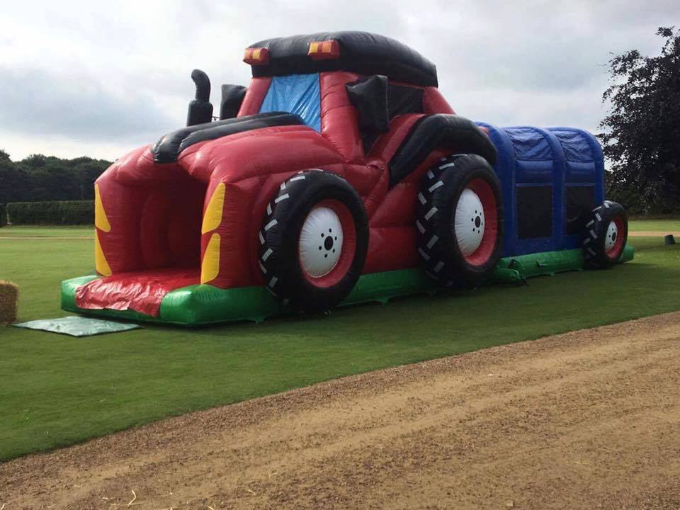 Inflatable tractor obstacle course set up in Cheshire for a birthday celebration Inflatable tractor obstacle course set up in Cheshire for a birthday celebration